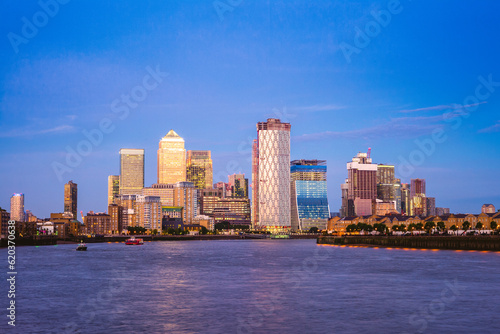 london skyline at Canary Wharf by river thames photo
