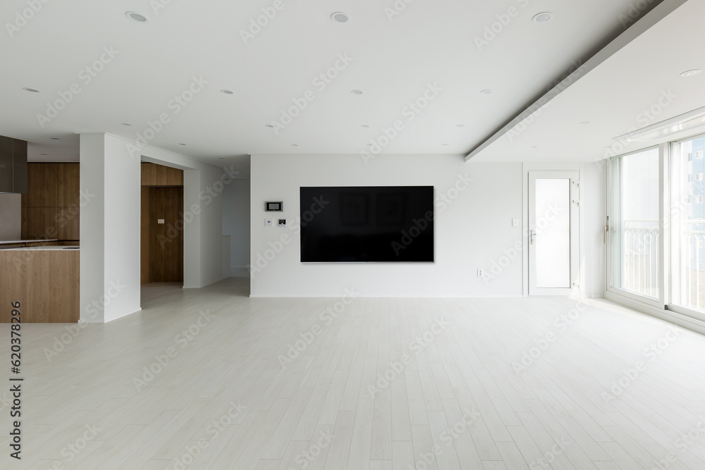 Blank modern flat screen TV hanging on wall in living room Blank modern flat screen TV hanging on wall in living room