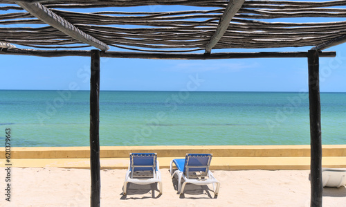 Two chairs on sand Beach at holiday resort venue in Merida (Yucatan, Mexico)