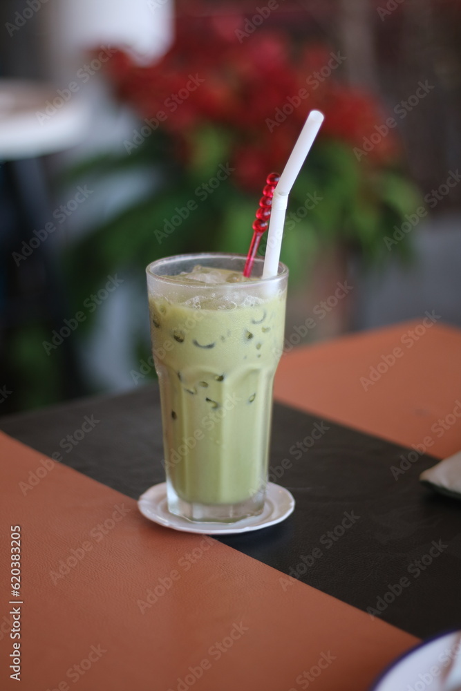 Closeup of Iced Caramel Macchiato at the coffee shop, Caramel Macchiato is a classic macchiato beverage. It consists of vanilla syrup, espresso, steamed milk, foam, and caramel drizzle Closeup of Iced Caramel Macchiato at the coffee shop, Caramel Macchiato is a classic macchiato beverage. It consists of vanilla syrup, espresso, steamed milk, foam, and caramel drizzle