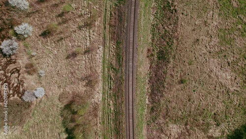 Tracking drone shot, looking down at railway tracks. photo