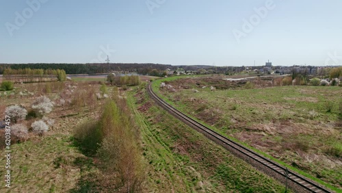 Flying over railway tracks drone shot in Starogard, Poland. photo