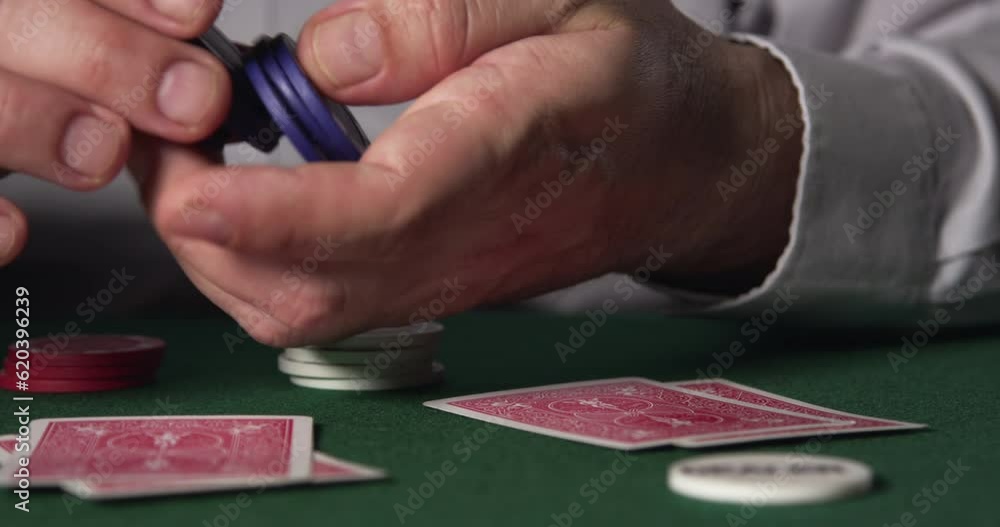Man Hand Playing With A Stack Of Chips Man Hand Playing With A Stack Of Chips