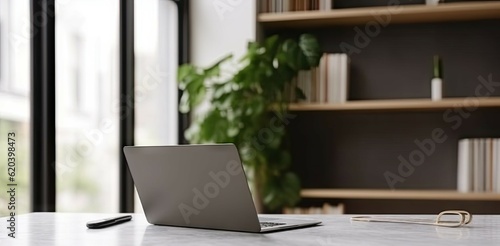 Modern Office Workspace with Laptop on Table for Business. Copy Space Available