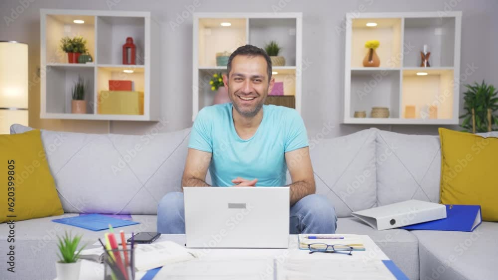 Home office worker man winks at camera. Home office worker man winks at camera.