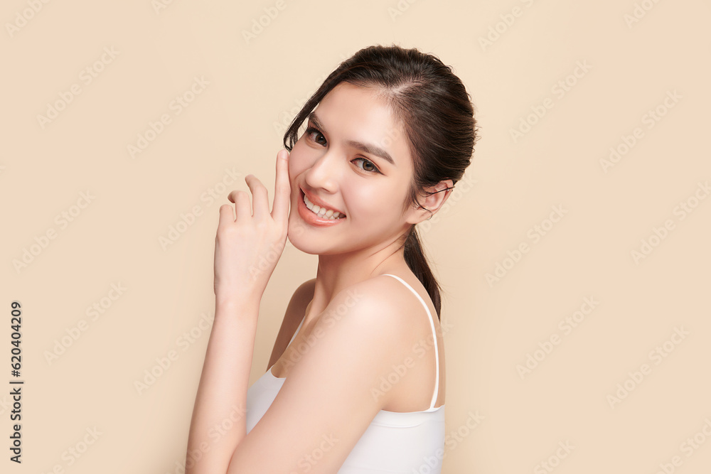 Beautiful young asian woman with clean fresh skin on beige background, Face care, Facial treatment, Cosmetology, beauty and spa, Asian women portrait. Beautiful young asian woman with clean fresh skin on beige background, Face care, Facial treatment, Cosmetology, beauty and spa, Asian women portrait.