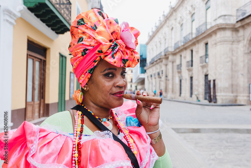 Cuban woman called canasteras with habano flowers and typical costume in La Havana, Afro caribbean people in Latin America photo