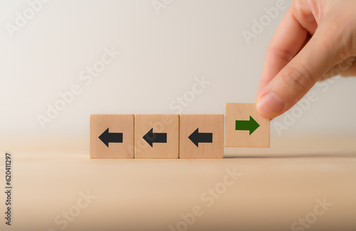 Fotografie New ways of working, differentiation strategy concept  symbol on wood blocks