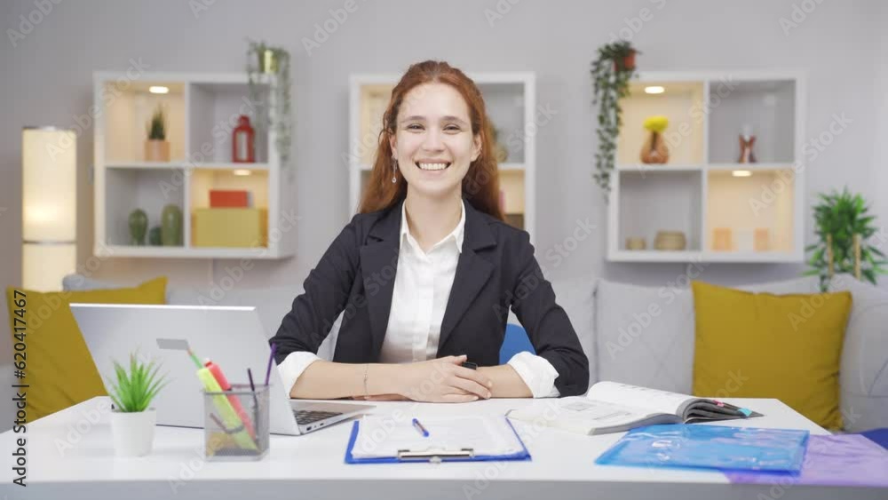 Home office worker woman smiles at camera. Home office worker woman smiles at camera.