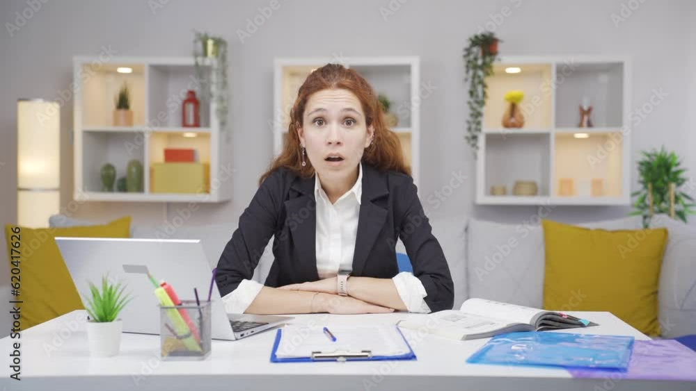 Home office worker woman looking at camera confused. Home office worker woman looking at camera confused.