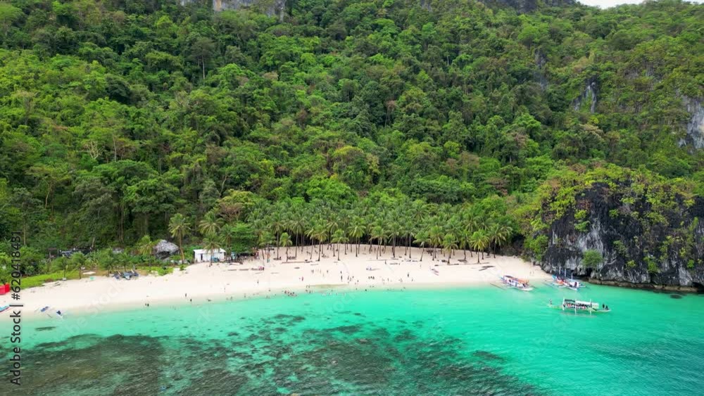 El nido Palawan region beach with coconut palm trees and paraw canoe