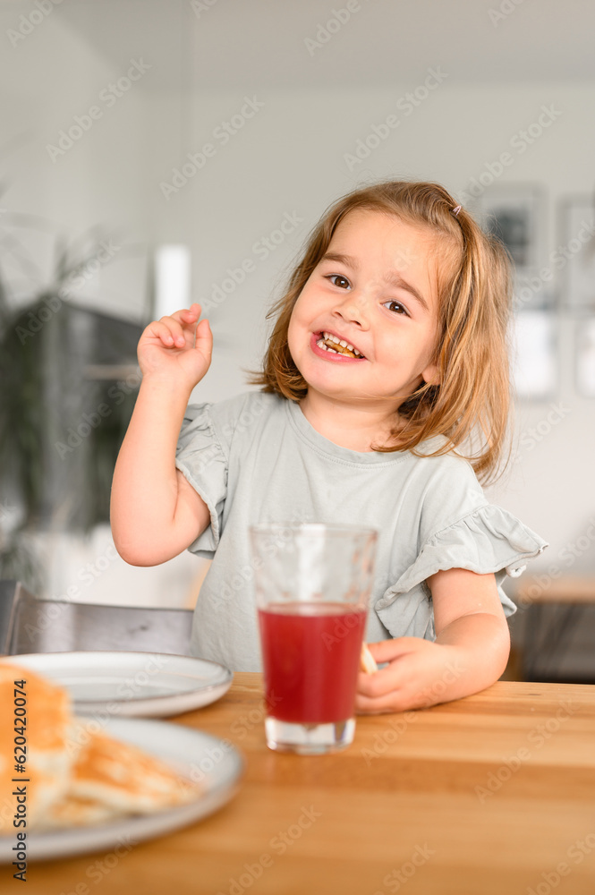Happy little girl showing thumb up Happy little girl showing thumb up
