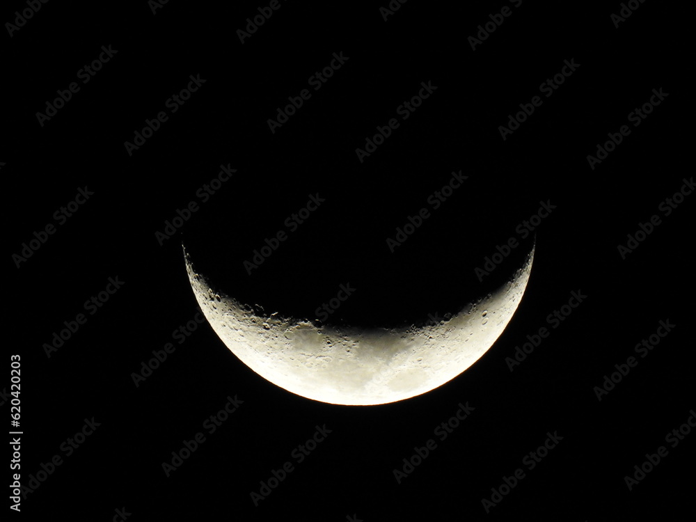 Half curved Moon. It is an astronomical body that orbits planet Earth. Half curved Moon. It is an astronomical body that orbits planet Earth.
