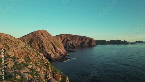 Drone follwing Coastline in a Beautiful Sunset Atmosphere in Northern Norway, Norwegian Cliff Landscape, North Cape, Scandinavia, photo