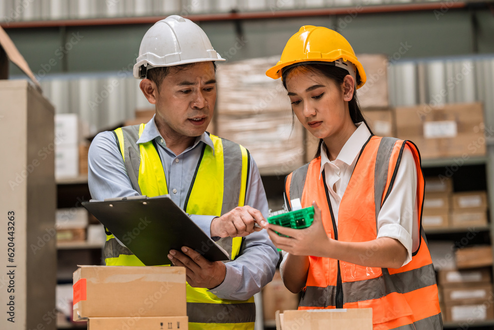 senior engineer manager supervisor working training young woman engineer staff worker in factory hardware parts store inventory room senior engineer manager supervisor working training young woman engineer staff worker in factory hardware parts store inventory room