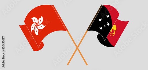 Crossed and waving flags of Hong Kong and Papua New Guinea