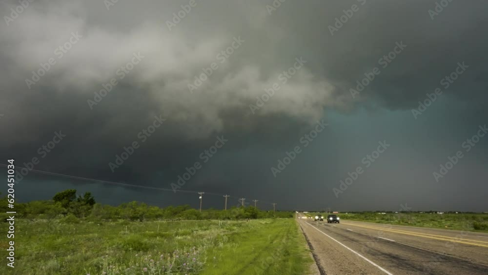 Huge Storm Looming Over Busy Road As Cars Drive Away Huge Storm Looming Over Busy Road As Cars Drive Away