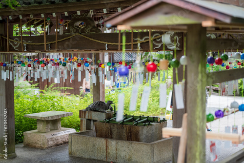 Kyoto, Japan - June 12 2023 : Japanese wind chimes at Matsunoo Taisha Shrine. Japanese Garden Wind bells. © Shawn.ccf