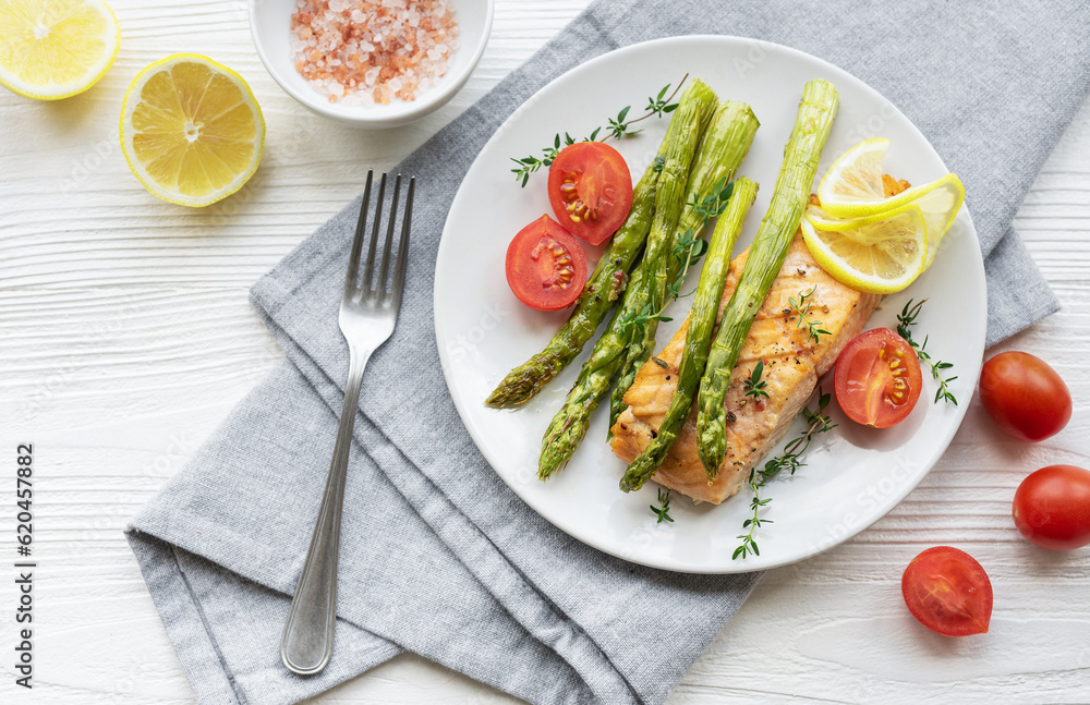 Baked Delicious salmon, green asparagus on plate Baked Delicious salmon, green asparagus on plate