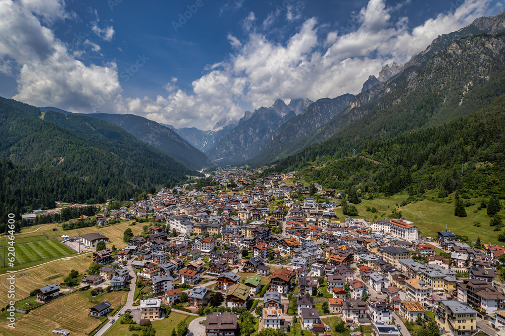 Cityscape of Auronzo di Cadore from above with the Dolomites' ranges in the  background