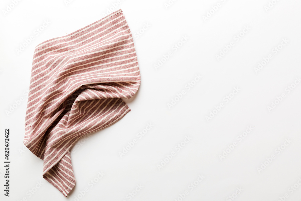 top view with red empty kitchen napkin isolated on table background. Folded cloth for mockup with copy space, Flat lay. Minimal style top view with red empty kitchen napkin isolated on table background. Folded cloth for mockup with copy space, Flat lay. Minimal style