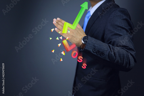 A businessman uses karate cuts to the chart to cut off the losses to keep profits in the portfolio.