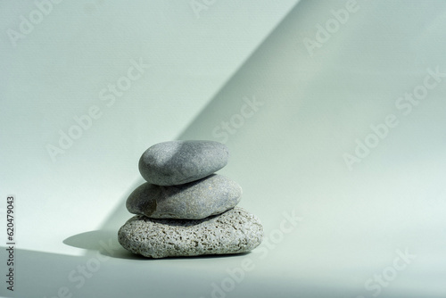 Composition empty podium material stone. Pastel green background. Beautiful background made of natural materials for product presentation.
