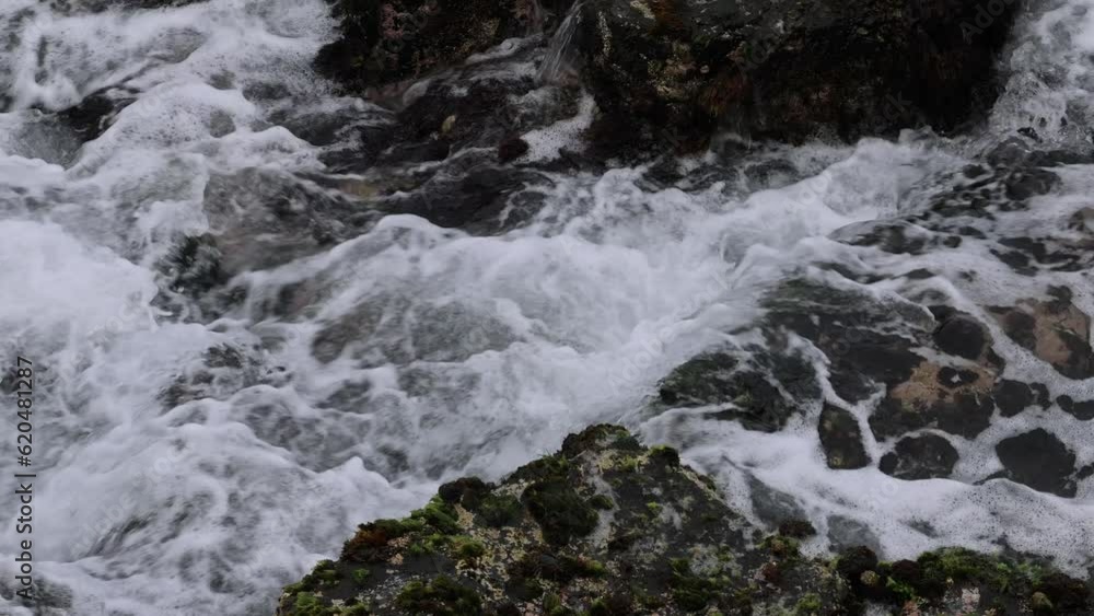 Ocean Waves Crashing Against Rocky Shoreline Ocean Waves Crashing Against Rocky Shoreline