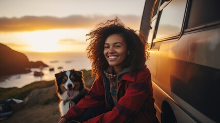An African American tourist smiles warmly, holding her dog at a mountain viewpoint, with a serene sea and mountain view in the soft morning light.