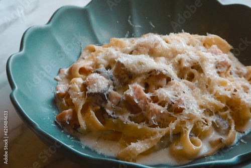 closeup mushroom cream pasta with bacon and cheese