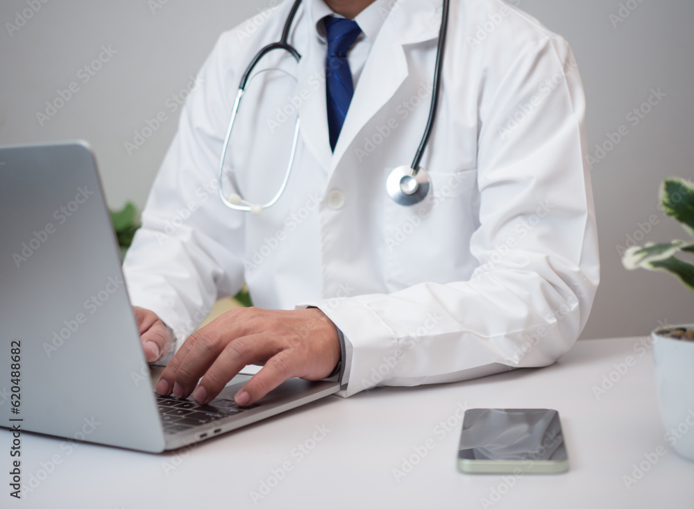 Doctors use smartphones and computers to research medical information. medical concept Doctors use smartphones and computers to research medical information. medical concept
