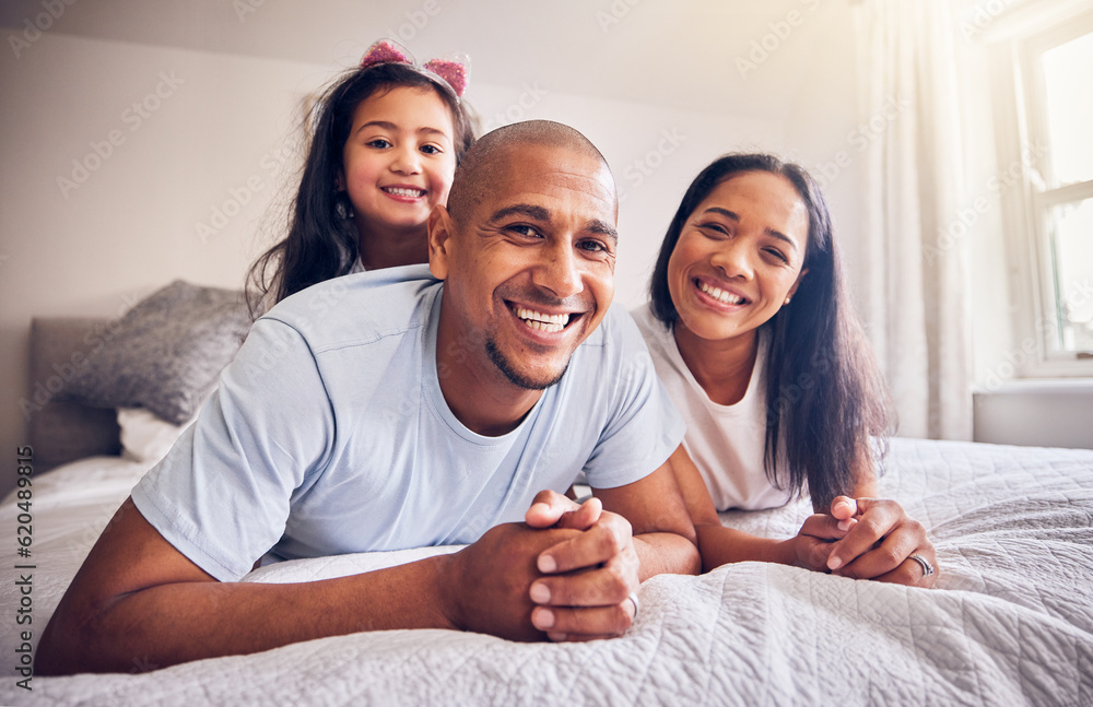 Family, relax and happy portrait on a bed at home while happy and playing for quality time. Man, woman or hispanic parents and a girl kid together in bedroom for morning bonding with love and care Family, relax and happy portrait on a bed at home while happy and playing for quality time. Man, woman or hispanic parents and a girl kid together in bedroom for morning bonding with love and care