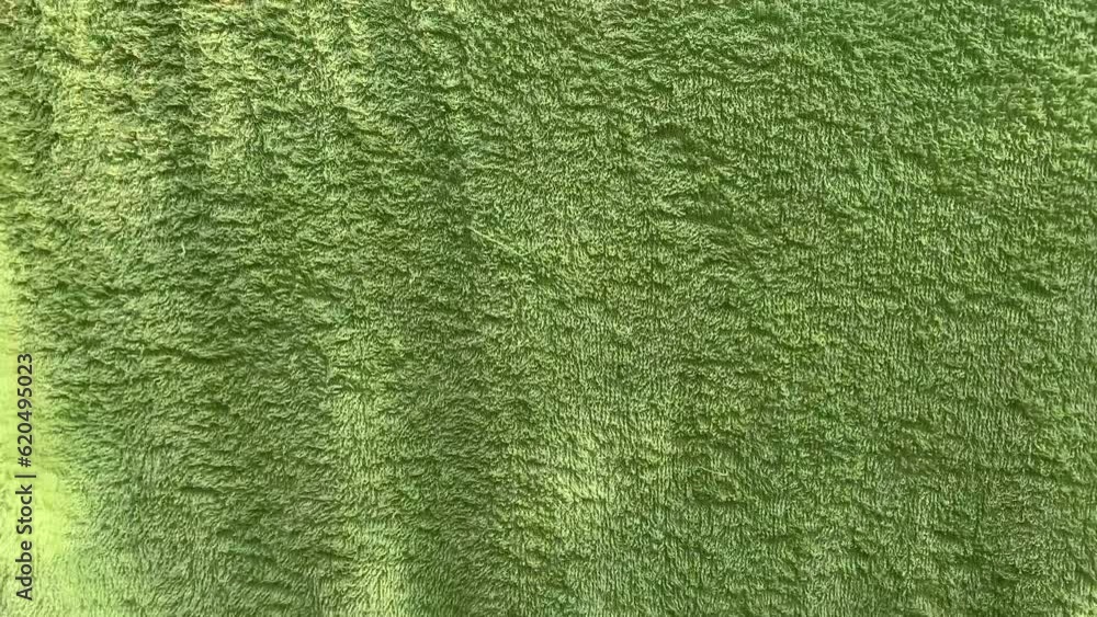 Green colored cloth fluttering. Background. Green colored cloth fluttering. Background.