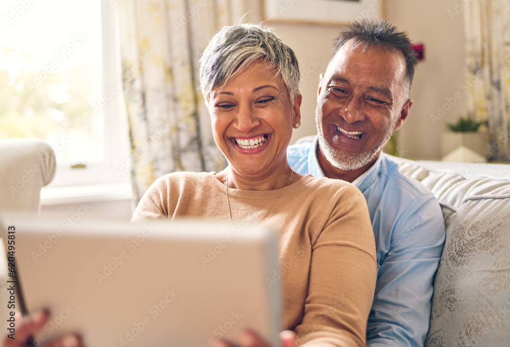 Happy, selfie and a couple with a tablet on the sofa for communication, social media or online chat. Smile, house and a senior man and woman taking a photo on technology on the couch and laughing Happy, selfie and a couple with a tablet on the sofa for communication, social media or online chat. Smile, house and a senior man and woman taking a photo on technology on the couch and laughing