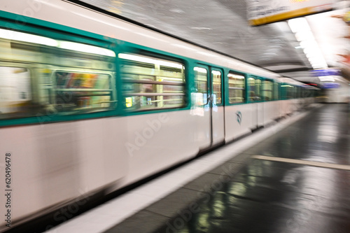 A moving underground train, blurred photo. Public transportation. Modern subway station in city centre. 