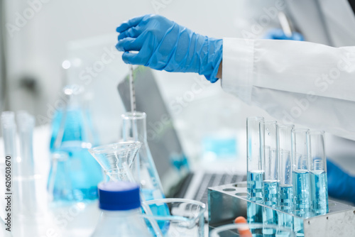 Obraz na plátně medicine research in chemical laboratory, chemist scientist working with liquid