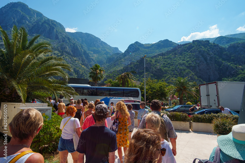 Φωτογραφία a crowd of tourists in a street of Kotor city Montenegro, a bright sunny day, mo