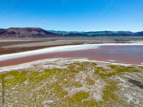 Argentina  Puna - aerial view of the colorful Laguna Carachi Pampa  a surreal and beautiful landscape surrounded by volcanic rocks and dunes of sand
