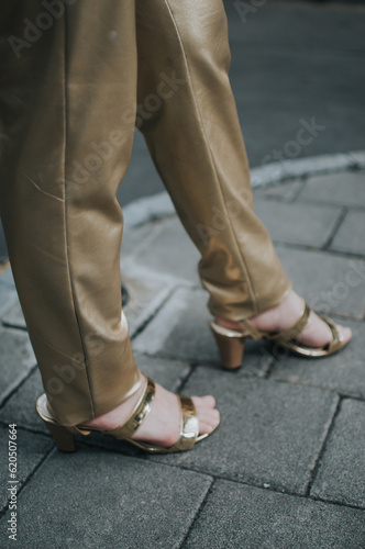 Gold leather pants with gold heels