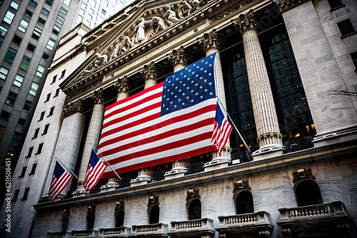 stock exchange at night with american flag hanging on the fascade of the building photo