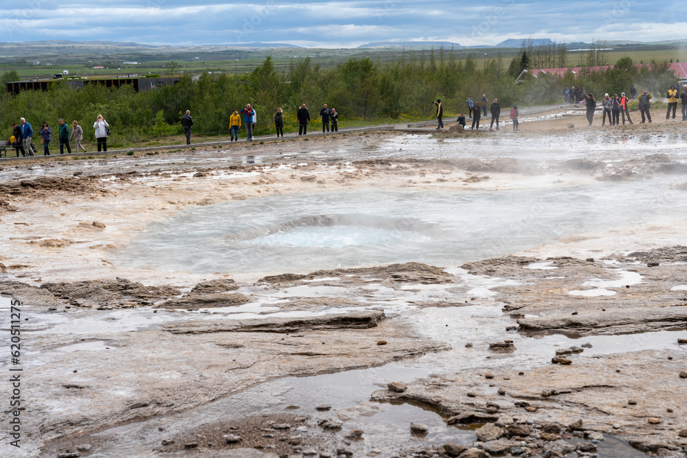 Iceland - 06.30.2023: Tourists waiting for Strokkur geyser to erupt
