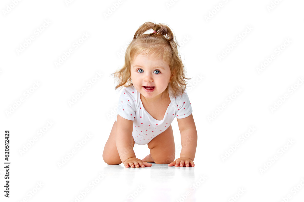 Happy, smiling, little, baby girl in diaper crawling on floor, playing against white studio background. Teeth Happy, smiling, little, baby girl in diaper crawling on floor, playing against white studio background. Teeth