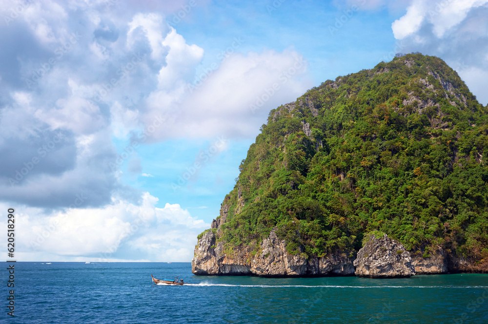 Cliff and the clear sea with boat  Phi Phi island in south of Thailand