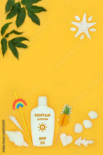 Factor fifty suntan lotion bottle for natural skincare protection with seashells, drink accessories, leaves and abstract starfish sun on yellow. Skin protection anti cancer concept.
