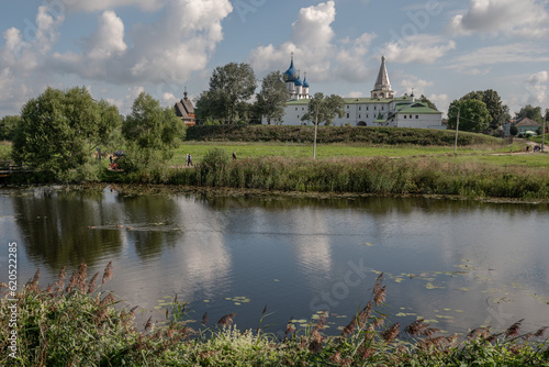 16 08 2020 Russia Suzdal city view  ancient churches against the backdrop of green meadows and blue sky. High quality photo