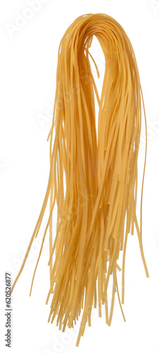 Artisanal raw linguini pasta with curvature after hanging for drying