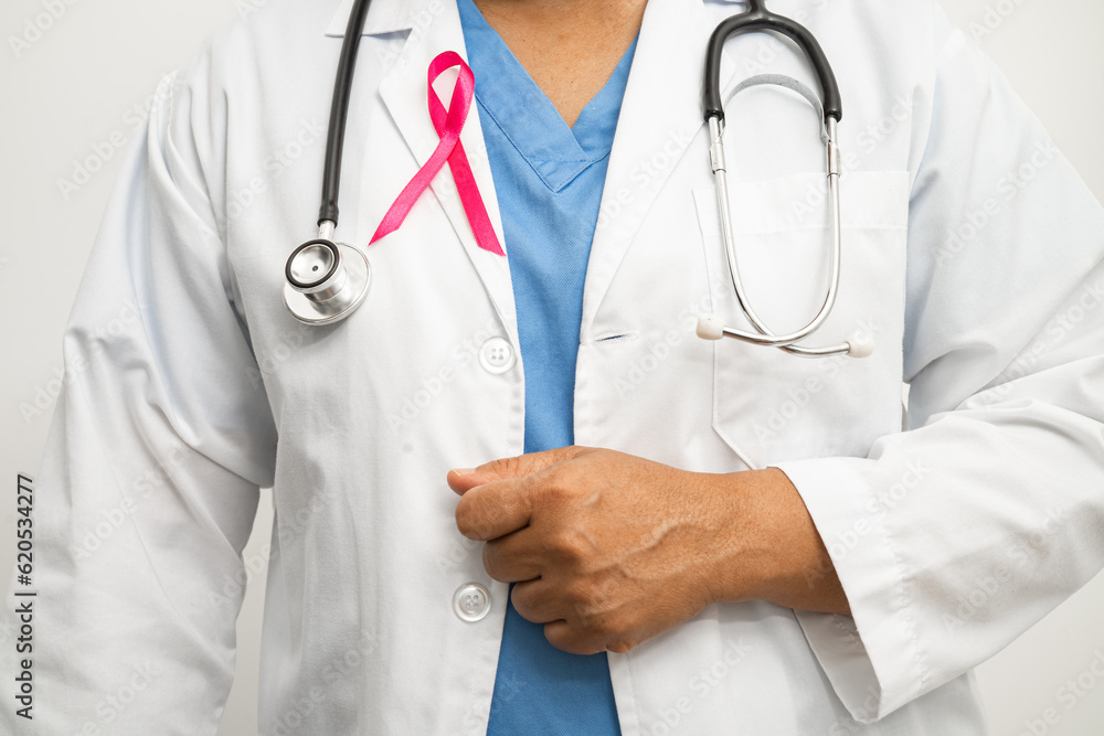 Breast cancer, Asian doctor woman with pink ribbon, symbol of World Breast Cancer Day. Breast cancer, Asian doctor woman with pink ribbon, symbol of World Breast Cancer Day.