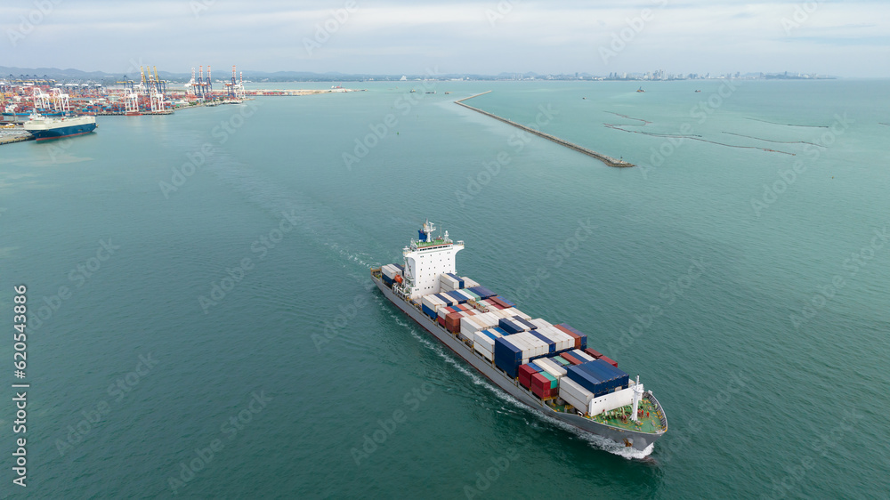 cargo container ship sailing full speed in sea to import export goods and distributing products to dealer and consumers across worldwide, by container ship Transport open sea. aerial view