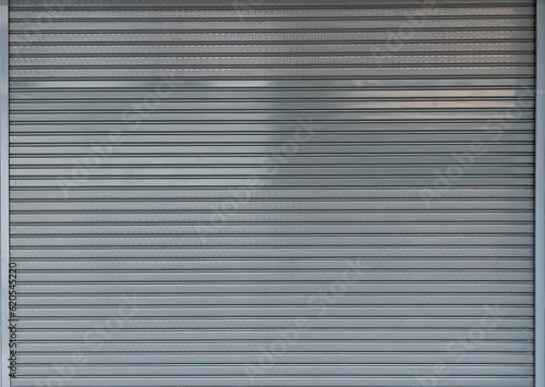 steel shutter door background and texture, folding steel door of shop.