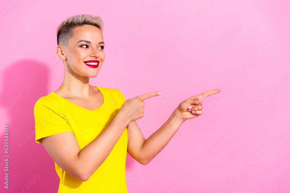 Photo of gorgeous positive girl beaming smile look indicate fingers empty space proposition advert isolated on pink color background Photo of gorgeous positive girl beaming smile look indicate fingers empty space proposition advert isolated on pink color background